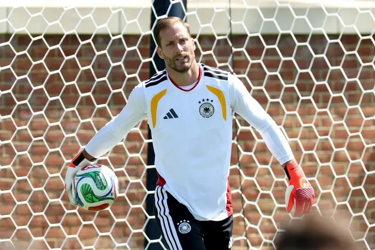 Goalkeeper holding soccer ball in training session