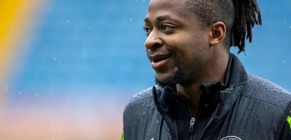 Player smiling during rainy training session