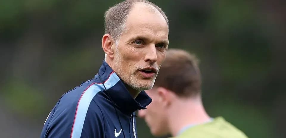Coach talking during training session with players