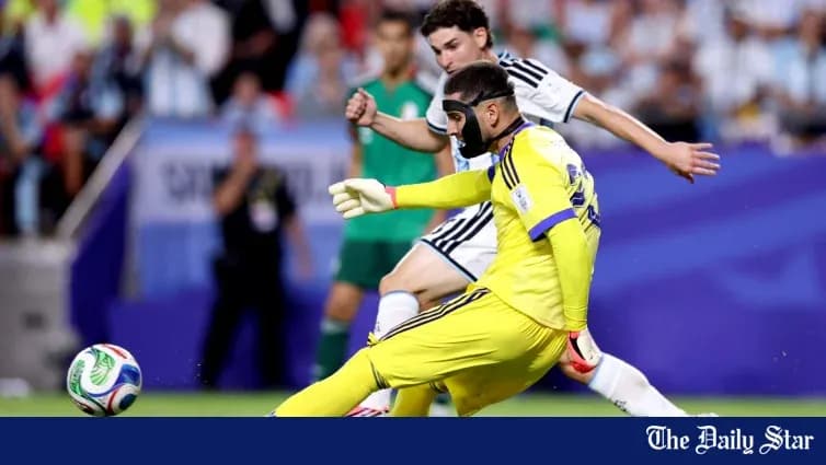 Goalkeeper in yellow kit making a save