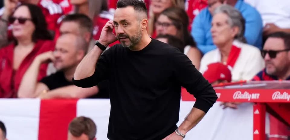 Coach on the sidelines during a match