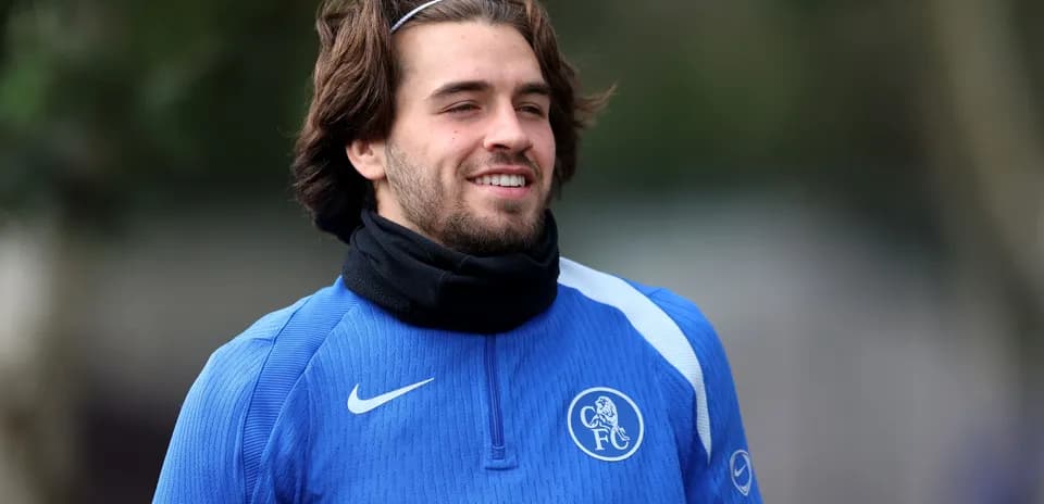 Player smiling during training session in blue jersey