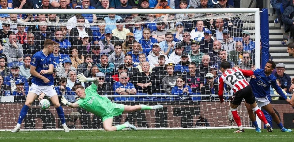 Goalkeeper saving a penalty in Everton match