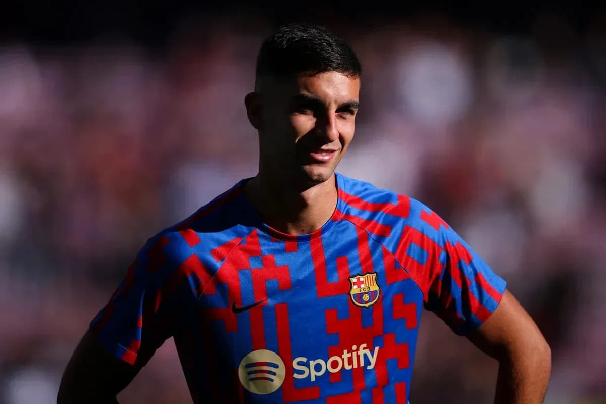 Player posing in Barcelona jersey with Spotify logo