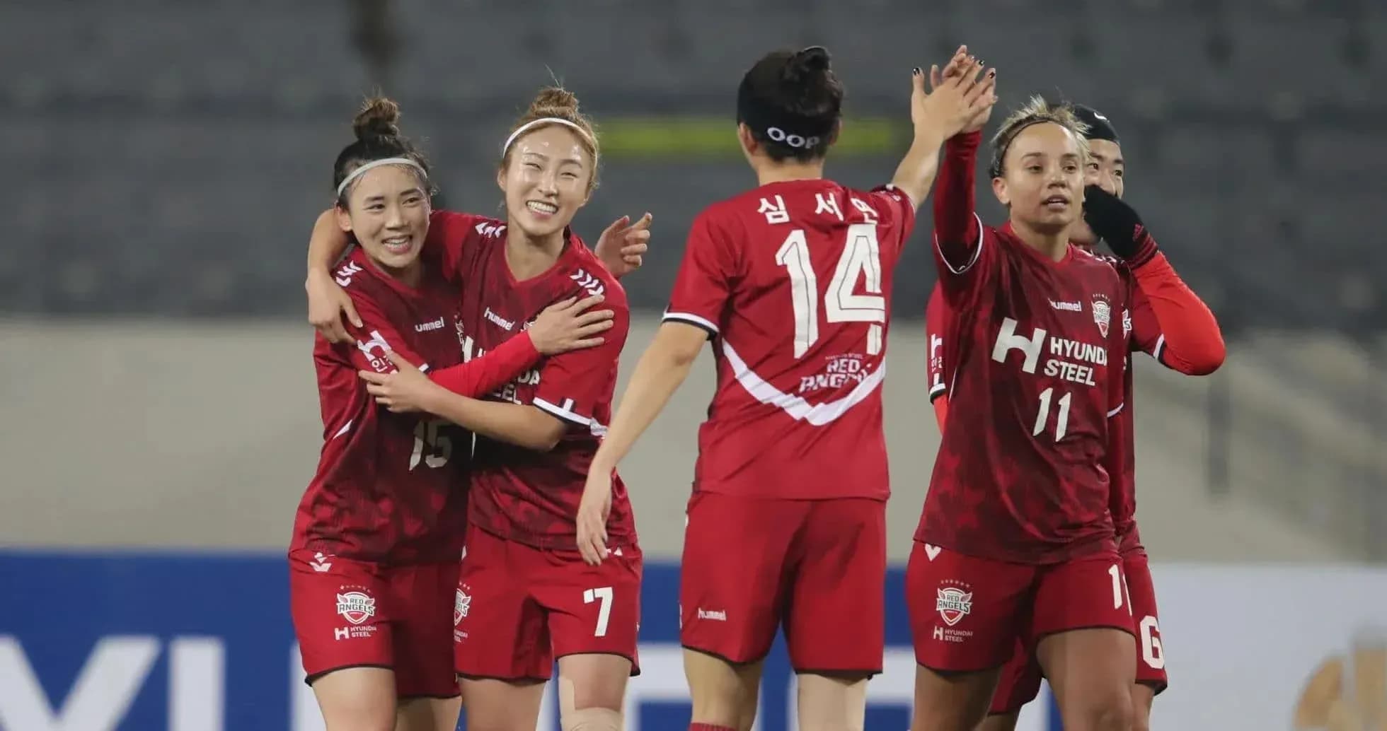 Players celebrating a goal during WK-League match