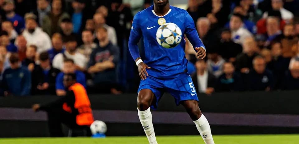 Player in blue jersey controlling a soccer ball