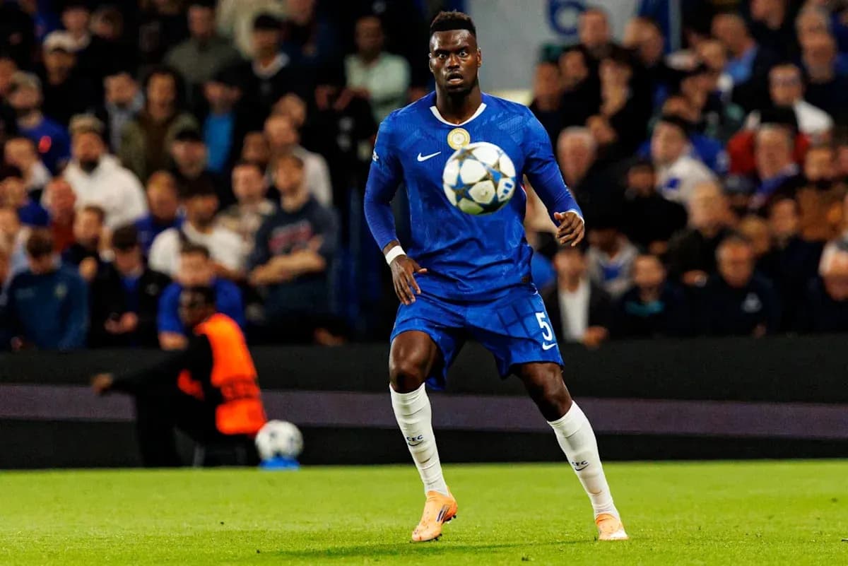 Player in blue jersey controlling a soccer ball