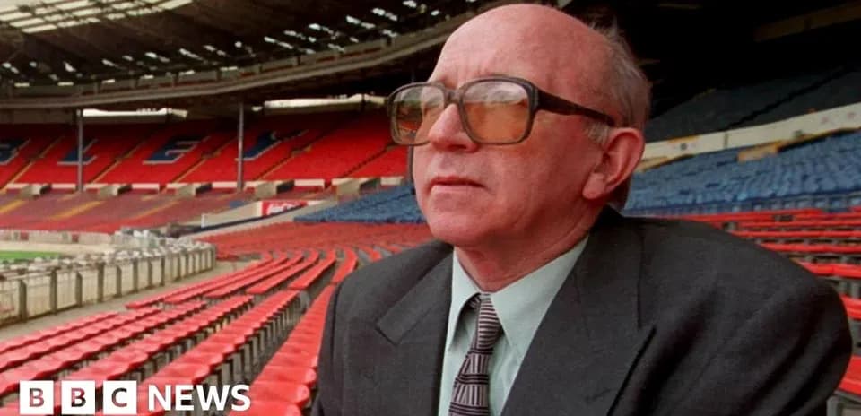 Man sitting in empty stadium seating area