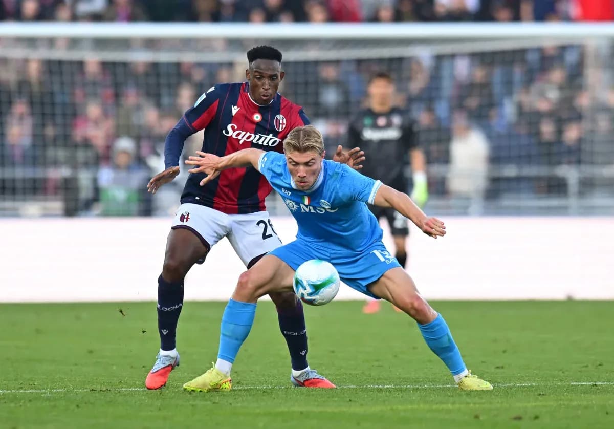 Players competing for the ball in Serie A match
