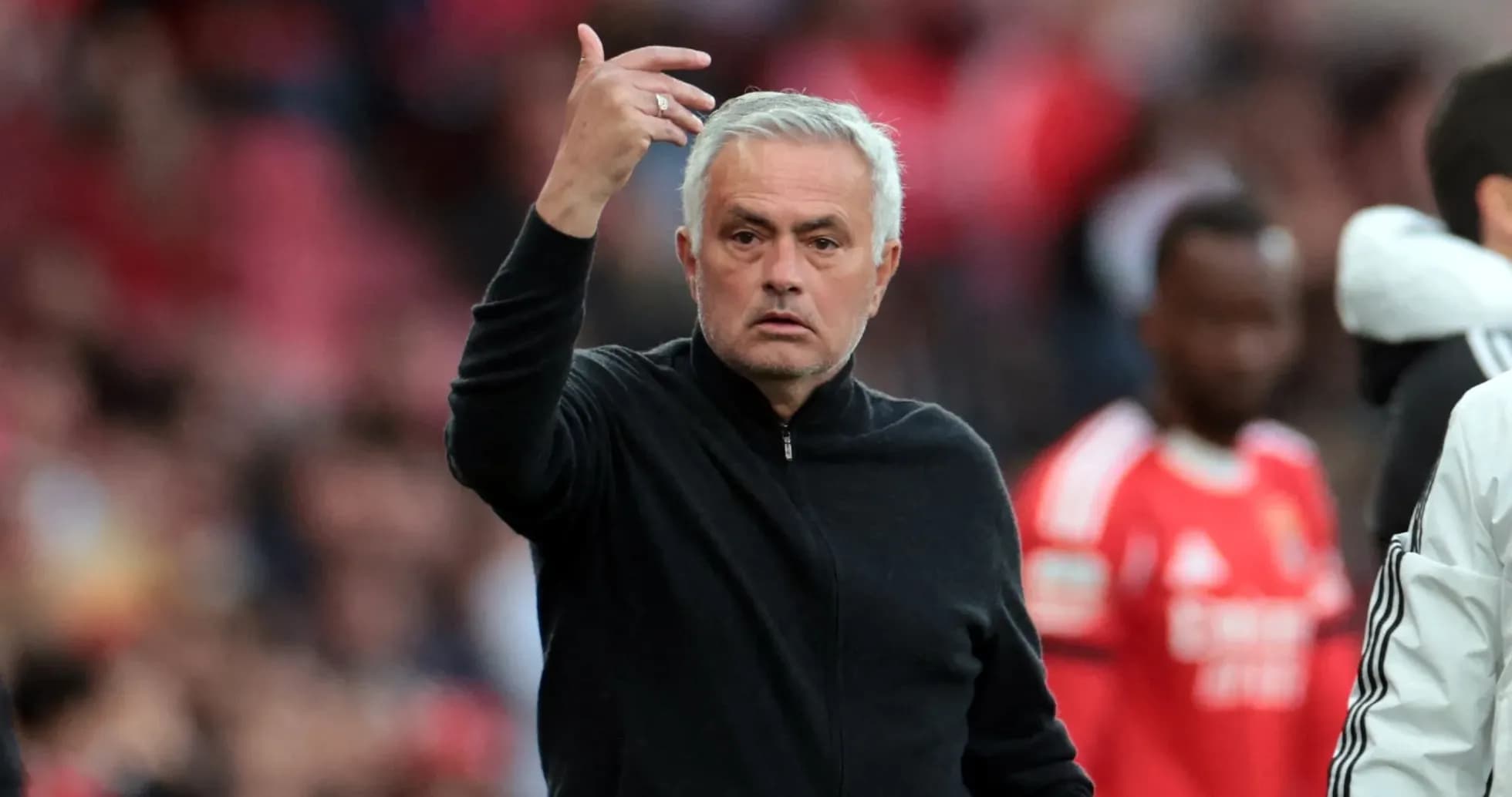 Manager gesturing during match from the sidelines