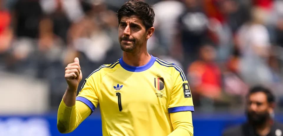 Goalkeeper in yellow jersey giving thumbs up