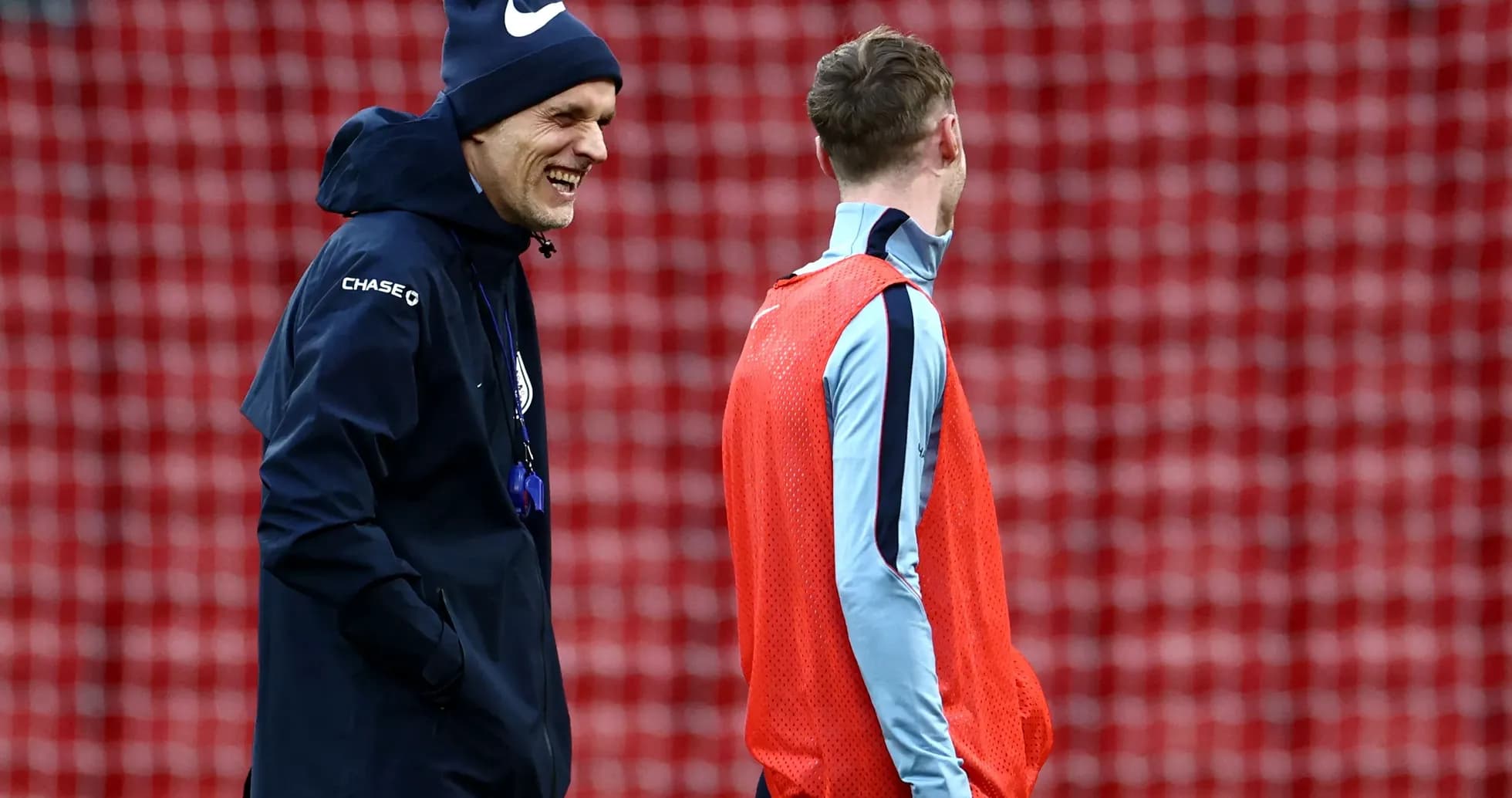 Coach and player smiling during training session