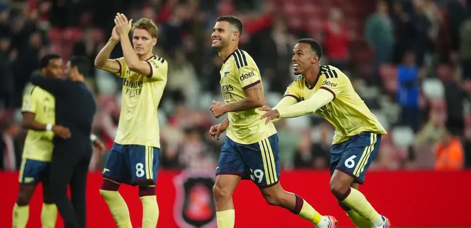 Players celebrating a goal during a match