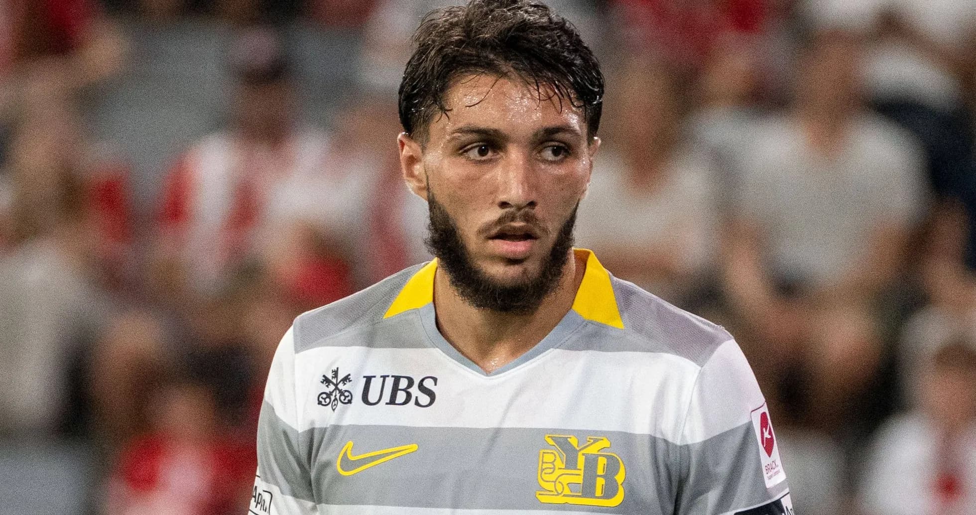 Player in yellow and gray jersey during match
