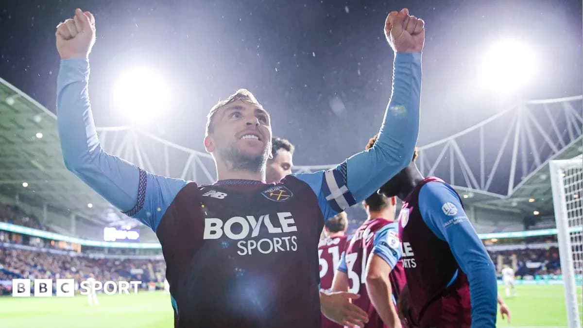 Player celebrating with raised arms after scoring