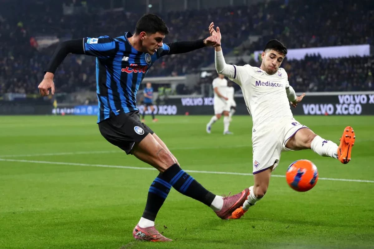 Fiorentina player tackling Atalanta opponent