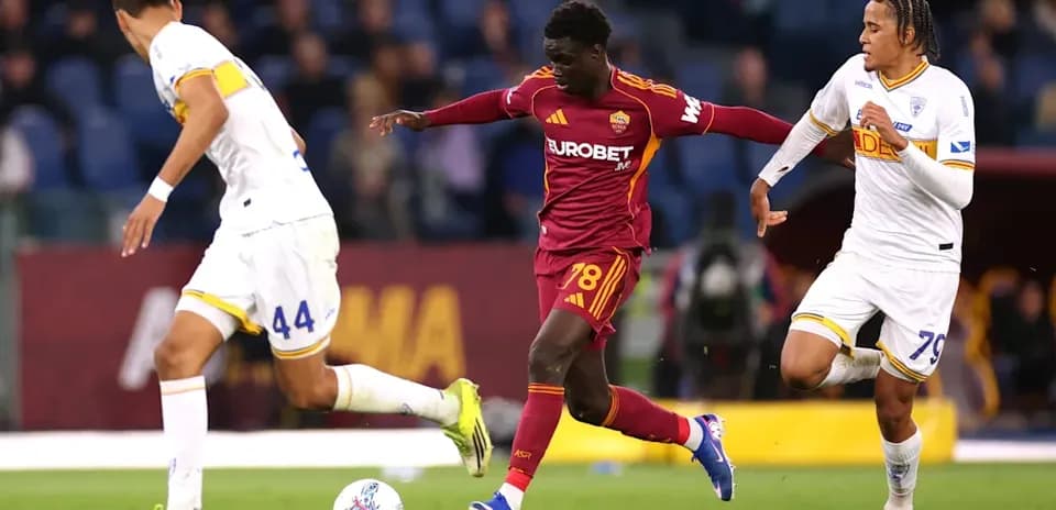 Player dribbling past opponents during a match