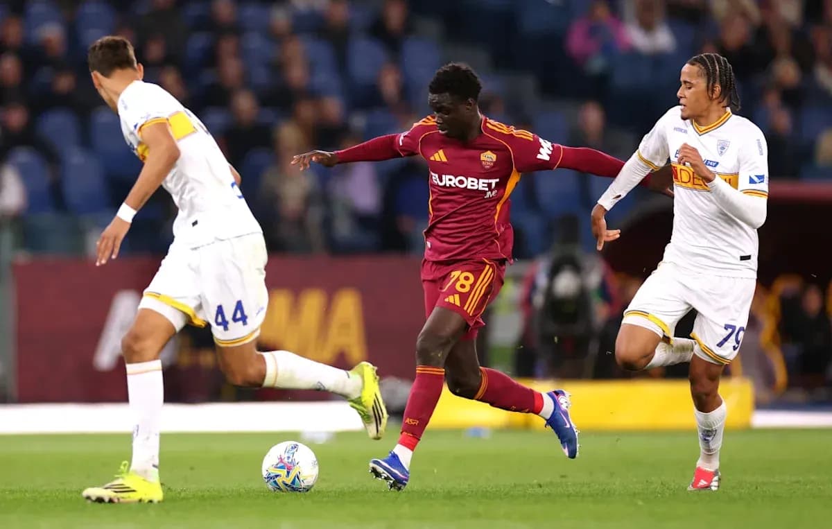 Player dribbling past opponents during a match