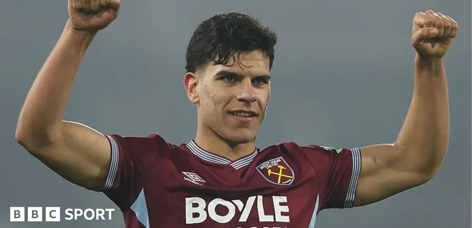 Player celebrating in West Ham jersey with raised fists