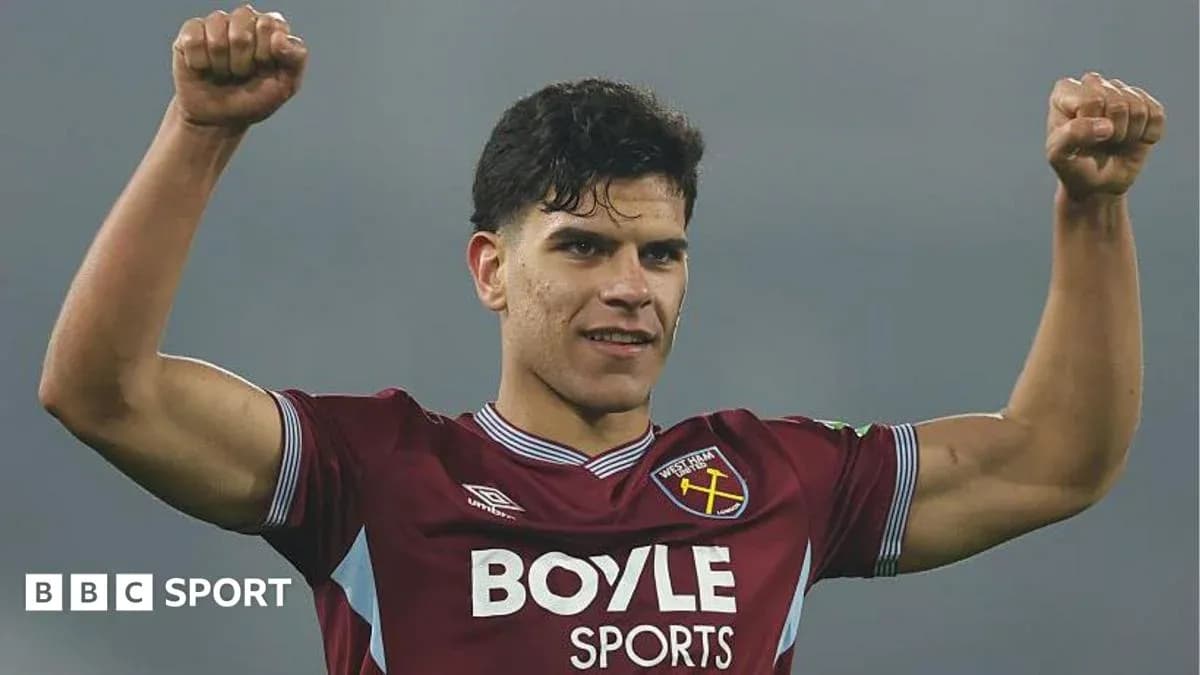Player celebrating in West Ham jersey with raised fists