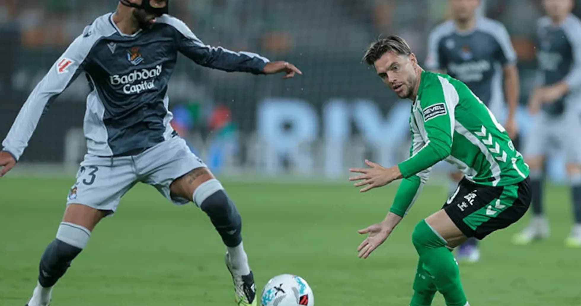 Players competing for the ball in La Liga match