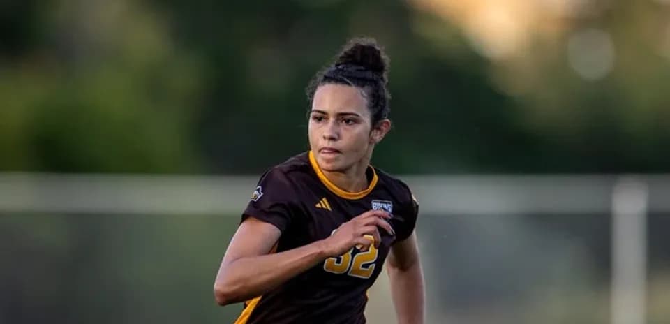 Female soccer player running on the field