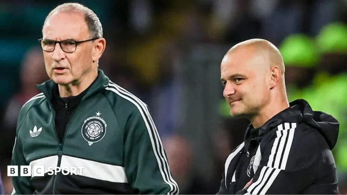 Two coaches discussing during a football match