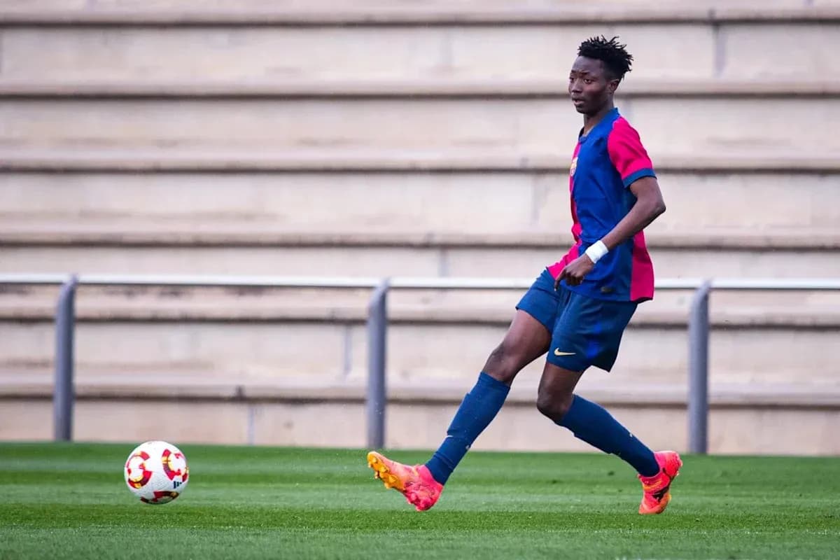 Player in Barcelona kit passing the ball on field