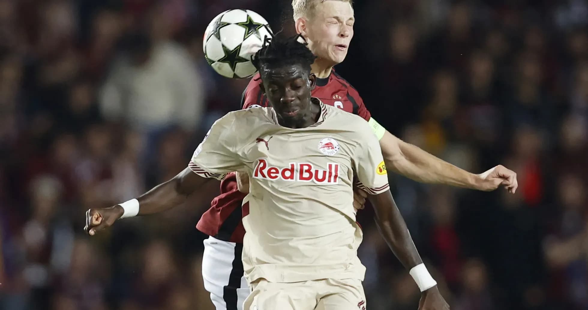 Players competing for the ball during match