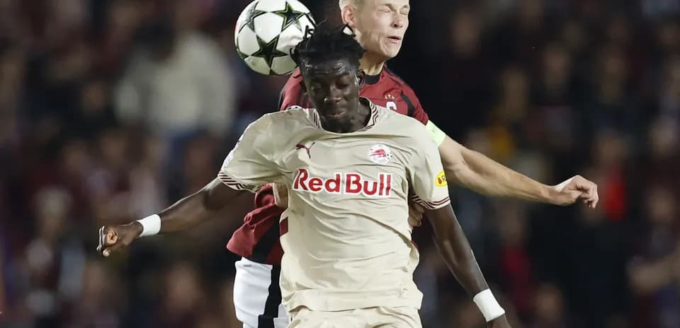 Players competing for the ball during match