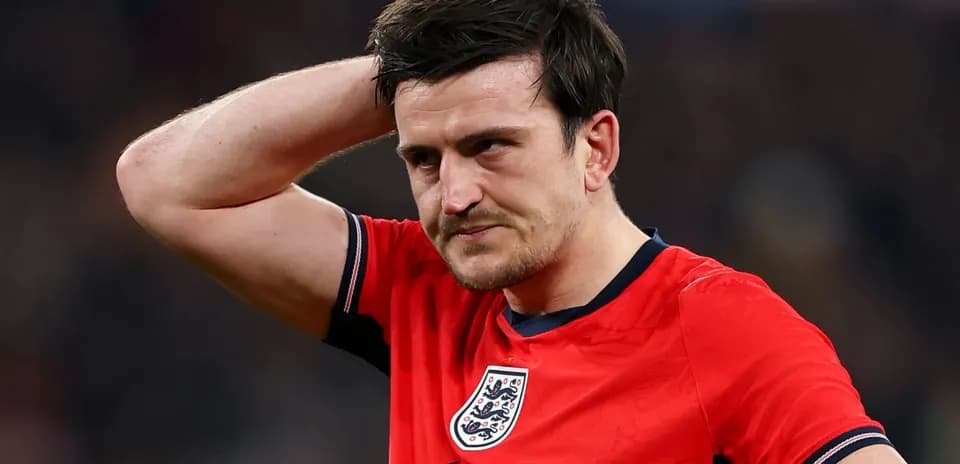 Player in red jersey looking frustrated during match