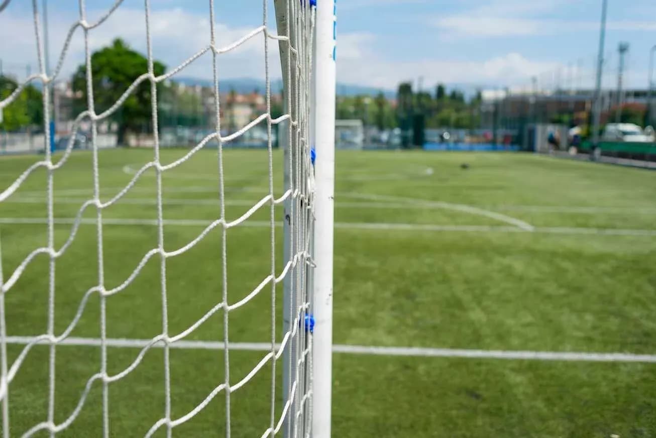 Close-up of soccer goal on grassy field
