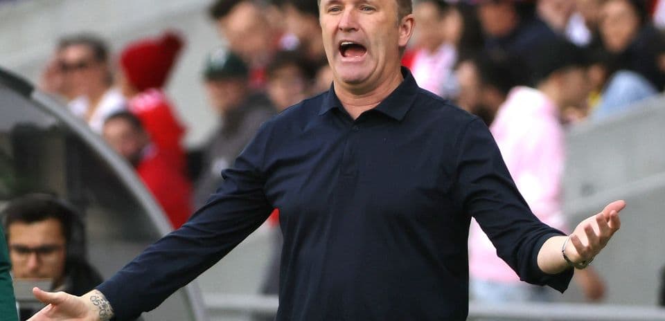 Coach gesturing during match from sidelines