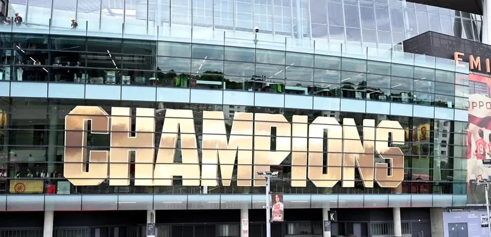 Champions sign displayed on stadium exterior