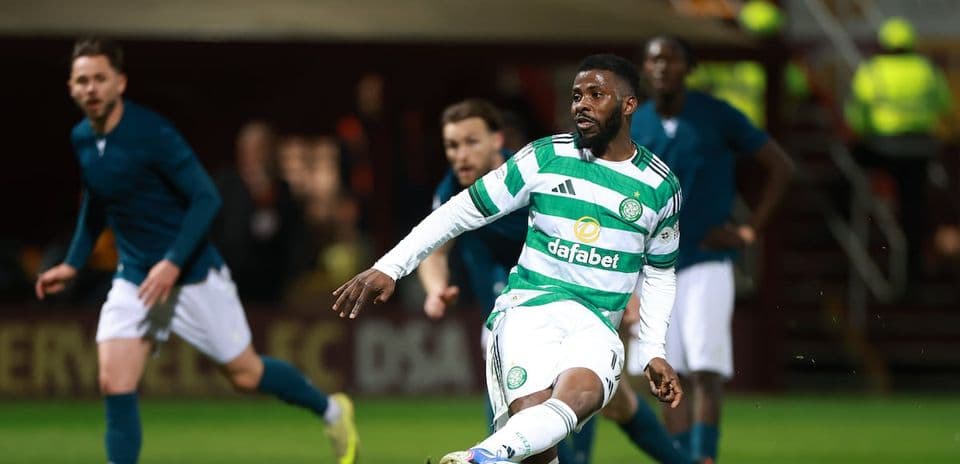 Celtic player dribbling the ball during match