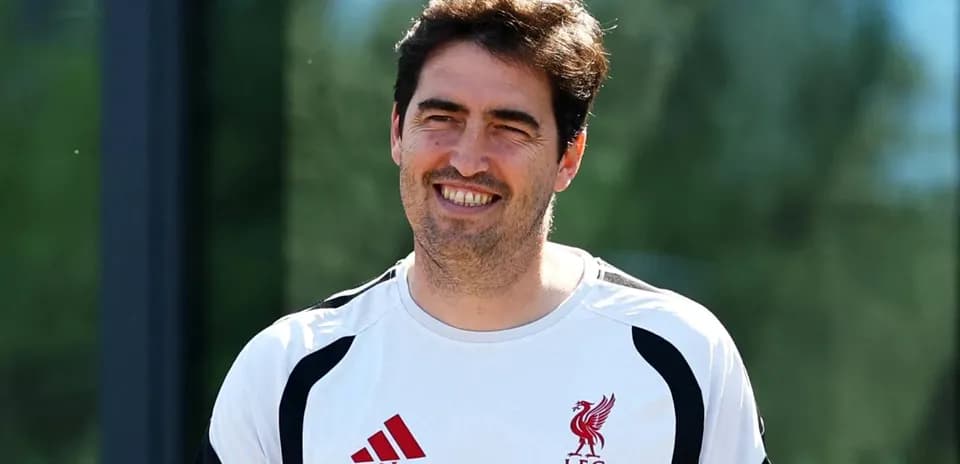 Coach wearing Liverpool training kit outdoors