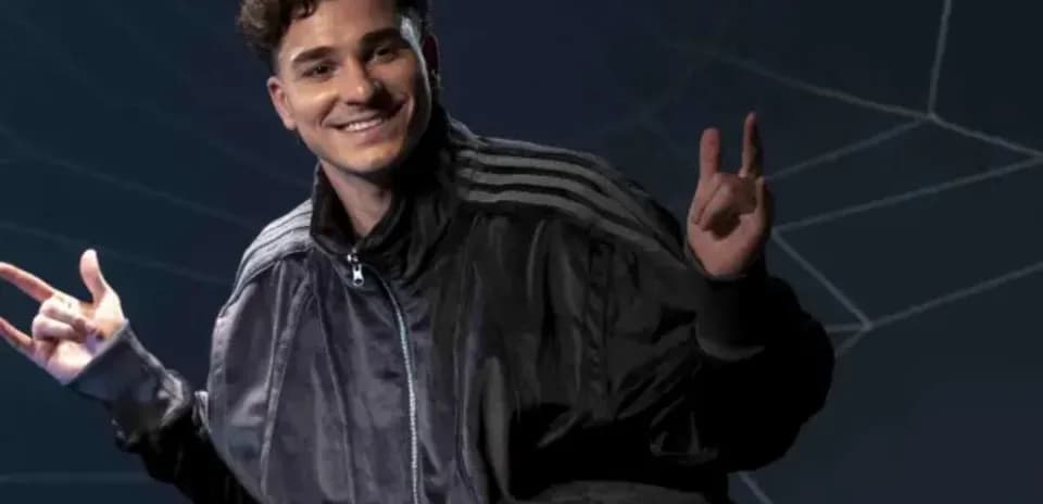 Person posing with hand gestures and smile