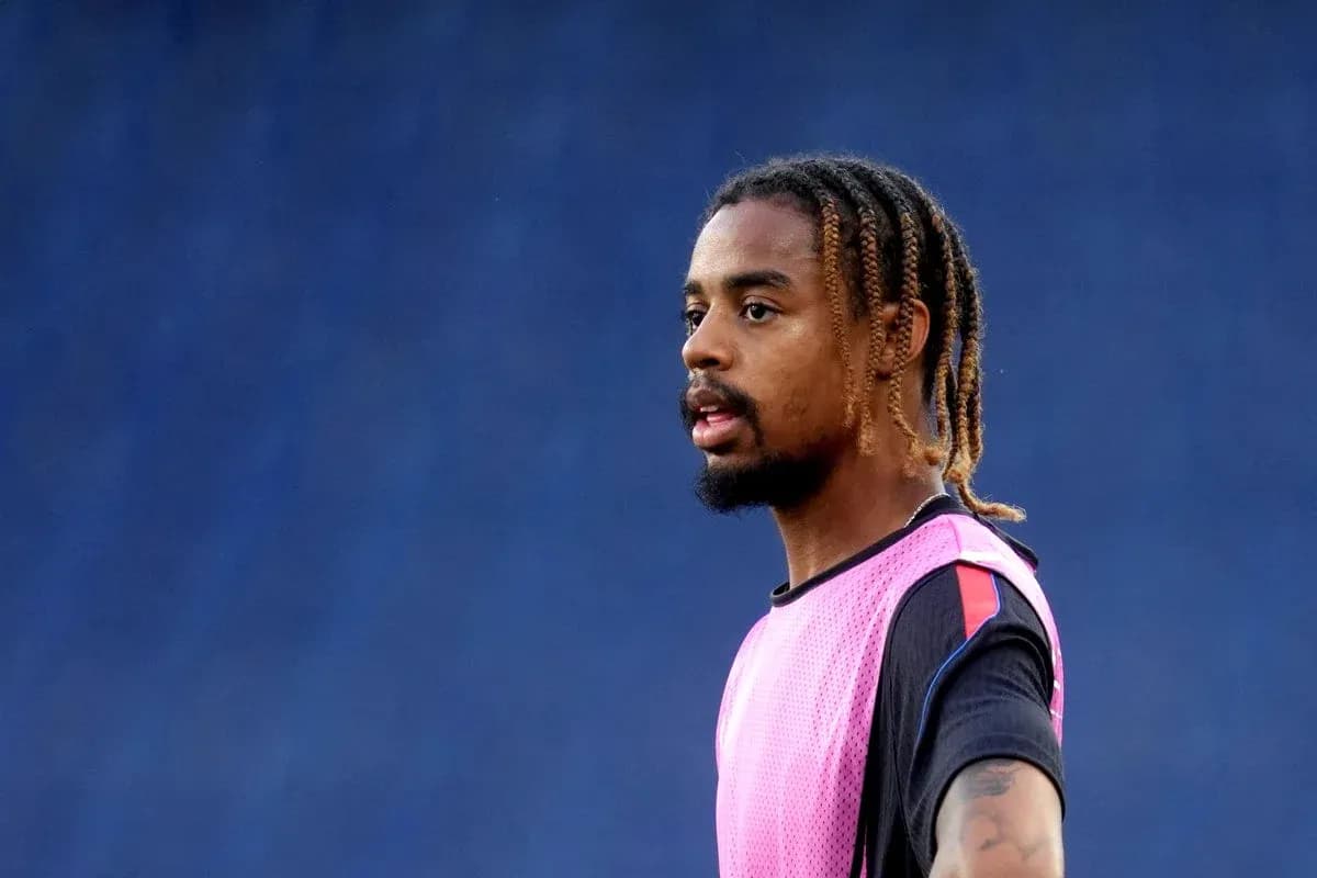 Player wearing pink training jersey during practice session