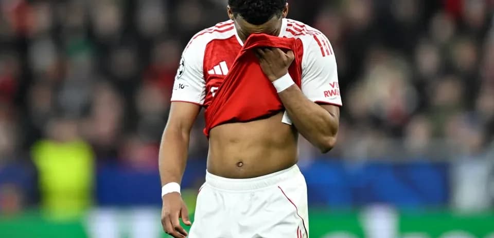 Player holding shirt while walking off field