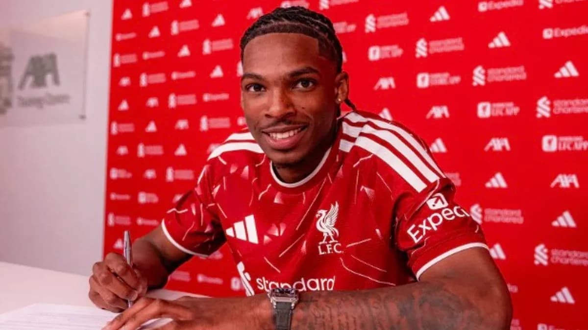 Player signing contract at Liverpool FC announcement