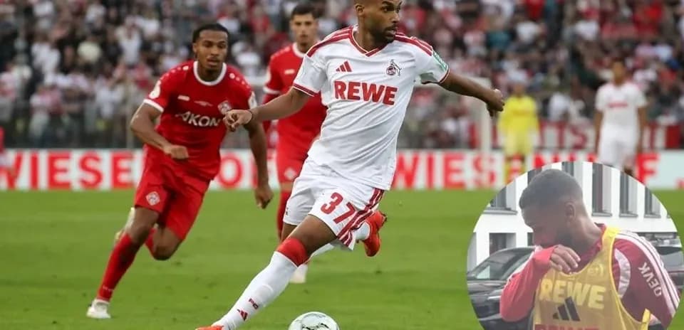 Player in white kit dribbling the ball during match