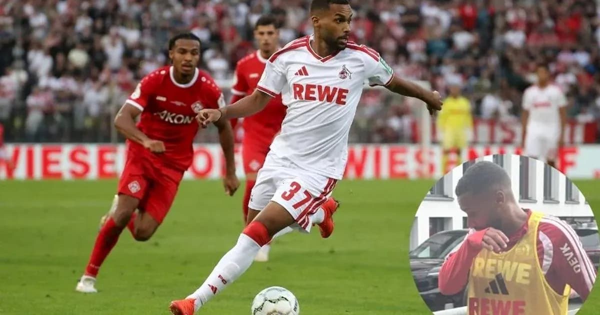 Player in white kit dribbling the ball during match