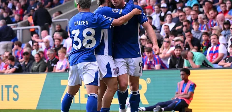 Players celebrating a goal during a match