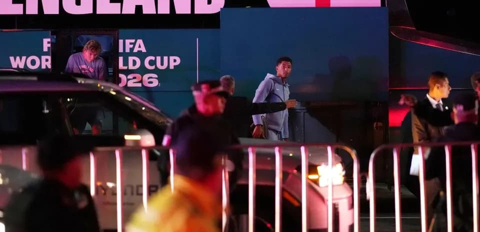 Players arriving at England team bus for World Cup