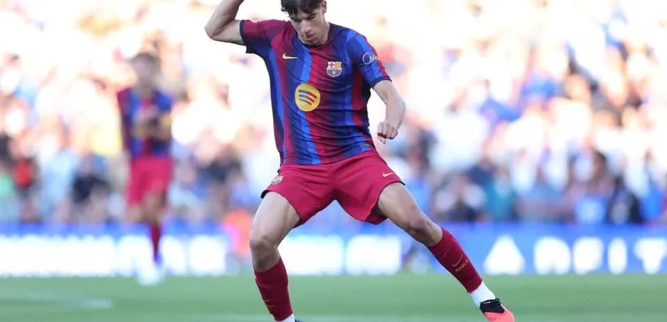 Player in Barcelona kit controlling the ball