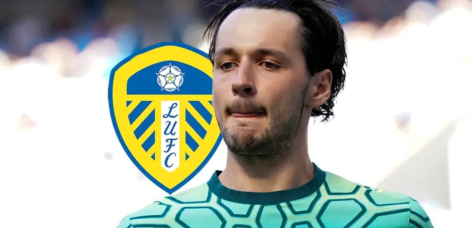 Goalkeeper wearing green jersey with Leeds United logo