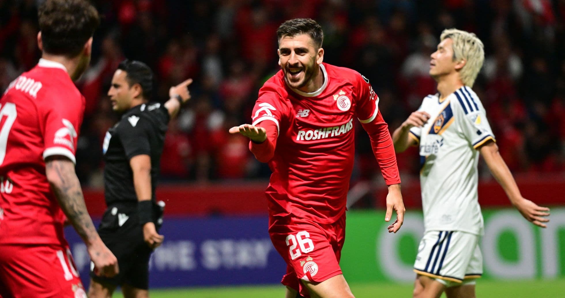 Toluca player celebrating goal during Champions League match