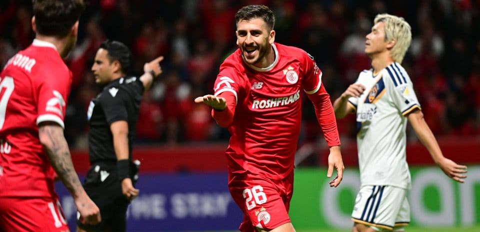 Toluca player celebrating goal during Champions League match