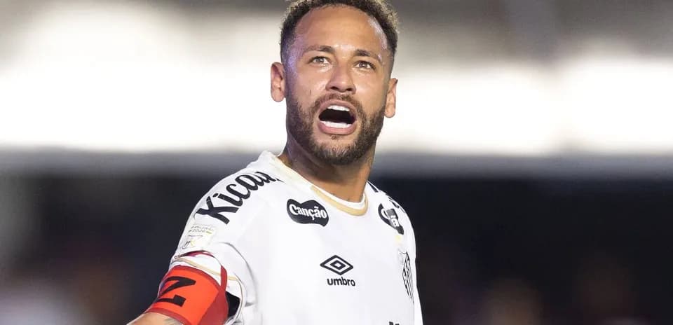 Player celebrating with arms raised on the field
