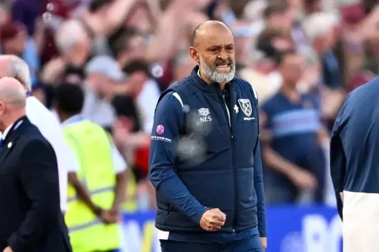 Manager celebrating during a match at the stadium
